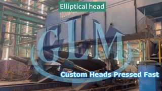 Elliptical heads are pressed using a drum press machine.