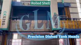 Precision machining of a pressure vessel shell on a large double-column vertical lathe.