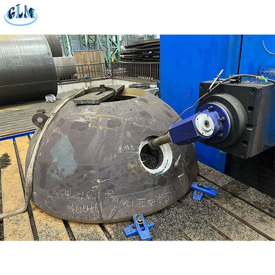 After the hemispherical head is formed, holes are drilled, and reinforcement is carried out according to pressure calculations to ensure strength.